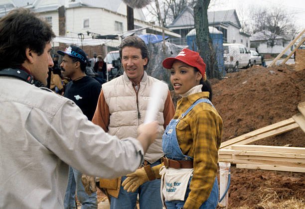 <IMG SRC='' Kimberly Aiken-3.jpg''alt='' Miss America participatin g in construction of homes for the homeless in the community''/>