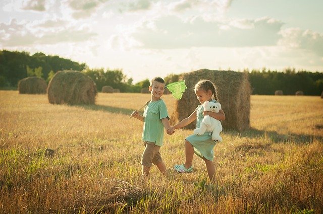 <src-img-2=''confident and resilient children playing in crops''>