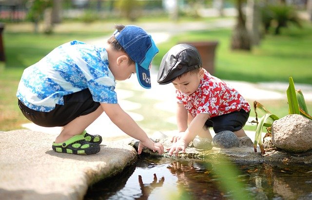 <src-img-3=''two kids playing inthe garden ''>